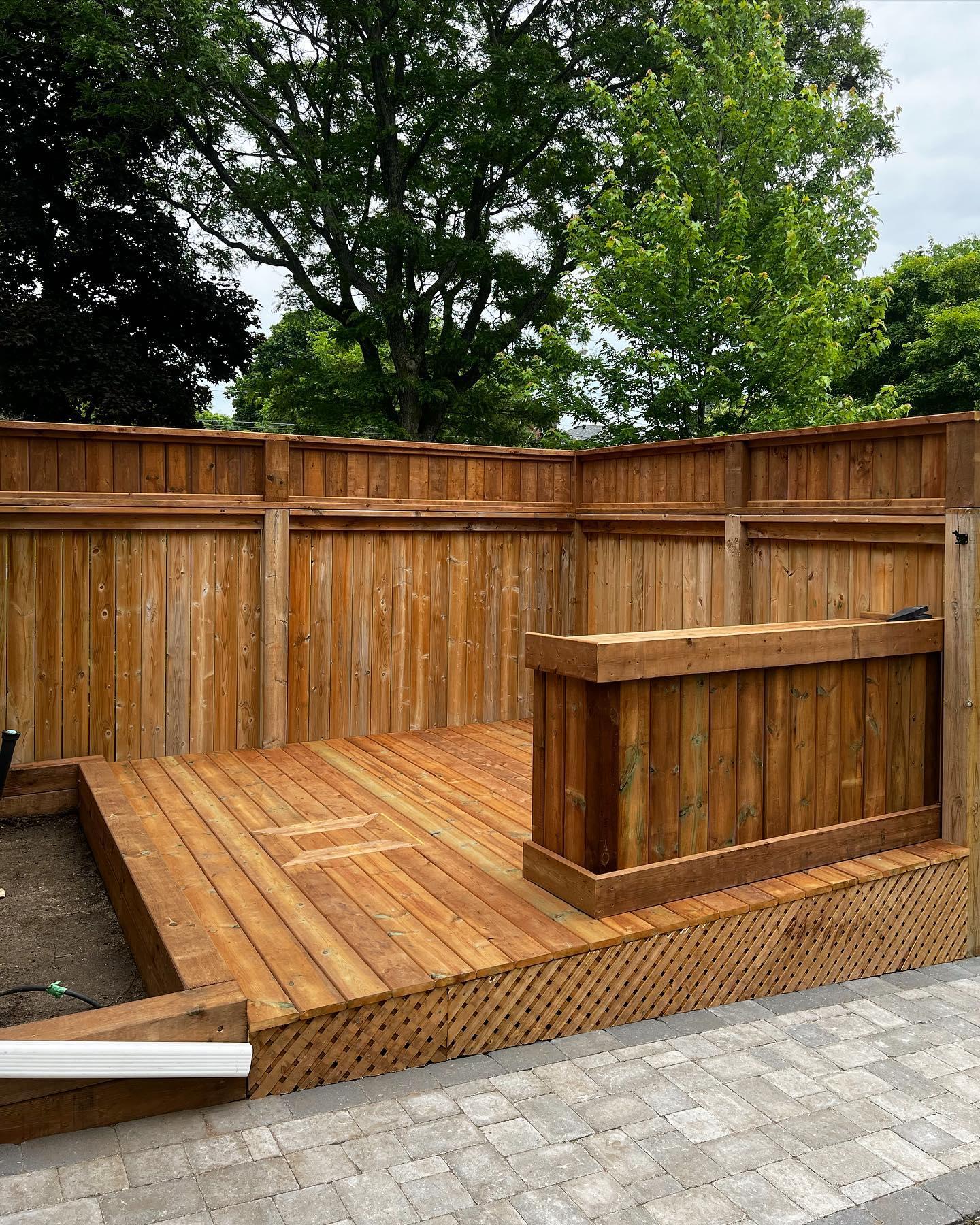 Custom wood deck with privacy fence and built-in bar counter
